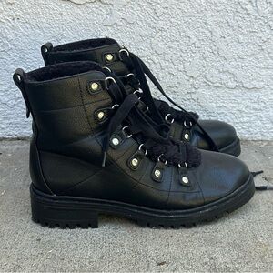 Black leather hiking boots with faux fur lining and side zipper closure